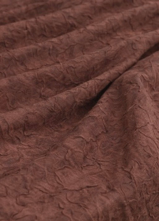 Zoom sur la texture du bambou : tissu fin, lisse et agréable, avec un toucher naturel et une finition soignée.